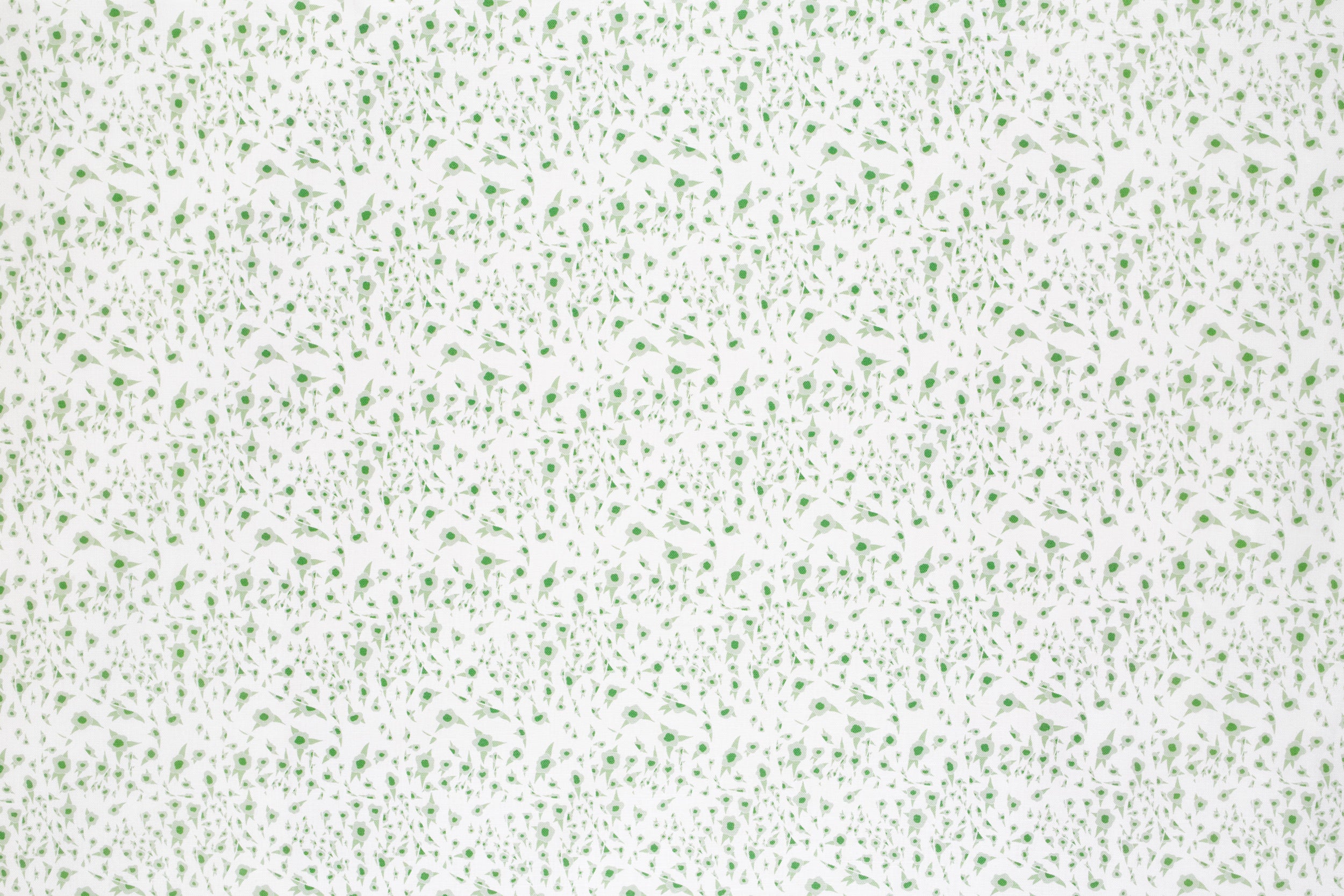 Detail of fabric in a small-scale floral pattern in green and gray on a cream field.
