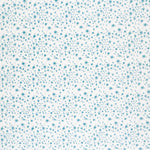 Detail of fabric in a small-scale floral pattern in shades of blue on a cream field.