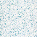 Detail of fabric in a small-scale floral pattern in shades of blue on a cream field.