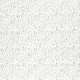 Detail of fabric in a small-scale floral pattern in shades of gray on a cream field.