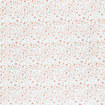 Detail of fabric in a small-scale floral pattern in pink and coral on a cream field.
