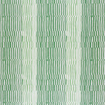 Detail of fabric in a dense broken stripe print in shades of green and white.