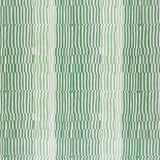 Detail of fabric in a dense broken stripe print in shades of green and white.