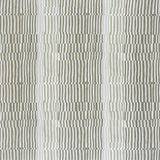 Detail of fabric in a dense broken stripe print in shades of tan, brown and white.
