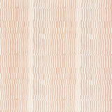 Detail of fabric in a dense broken stripe print in shades of peach and white.