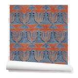 Wallpaper roll with a stamped painted floral motif in red and cobalt on a medium blue background