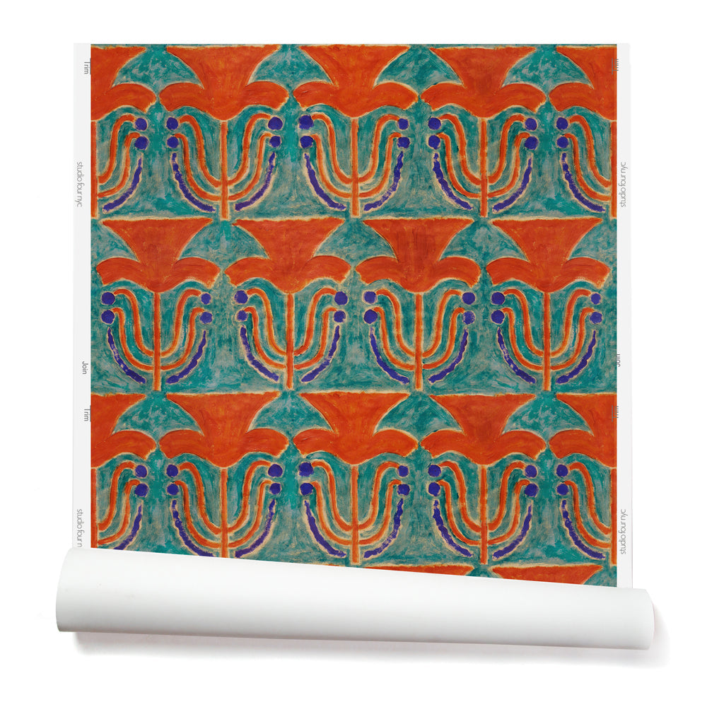 Wallpaper roll with a stamped painted floral motif in vibrant red and cobalt on an emerald green background
