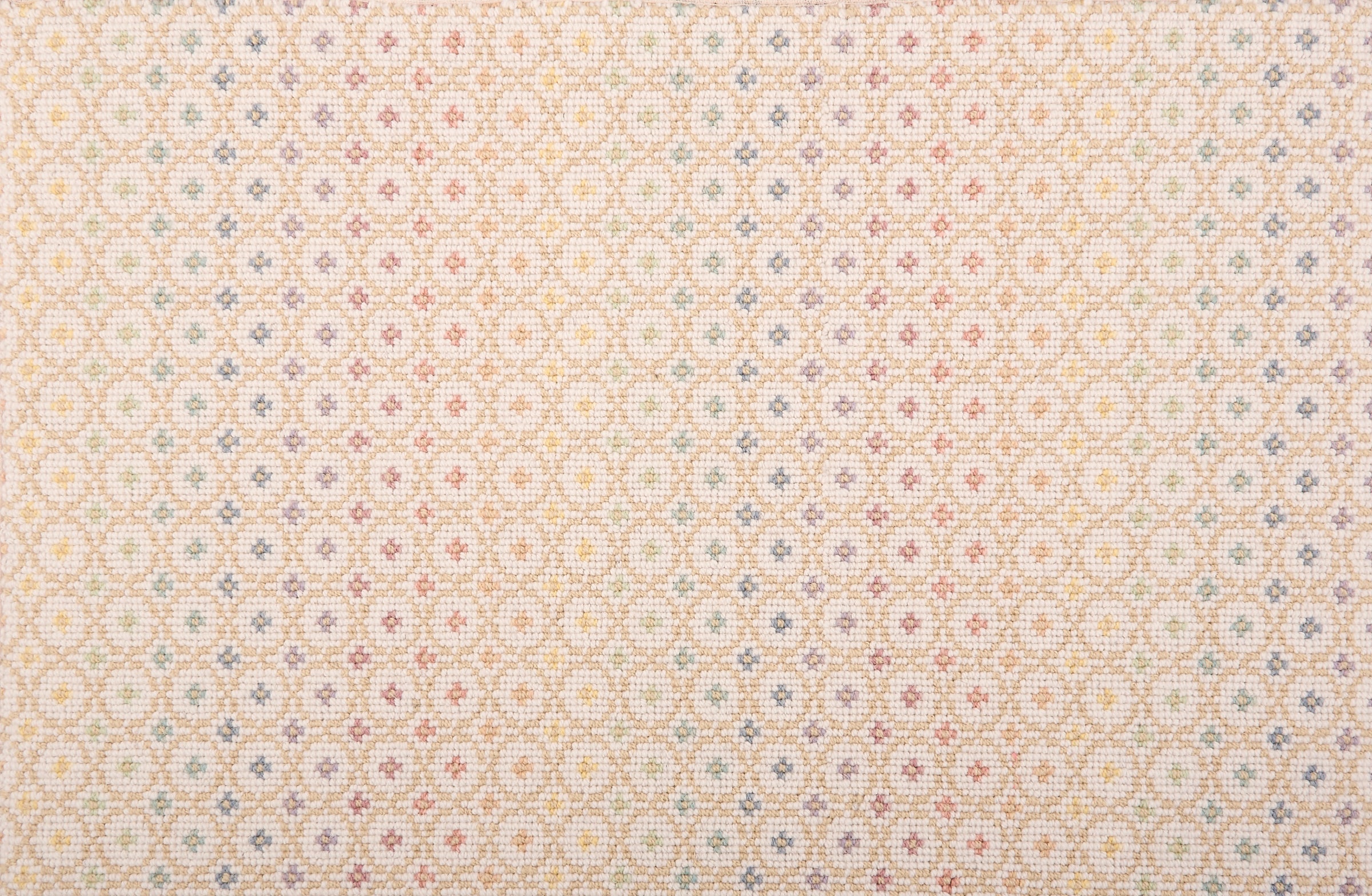 Broadloom carpet in a dense circle lattice with small floral accents in a ombré of rainbow pastels on a cream field.