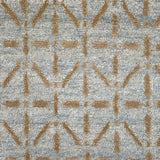 Handknotted rug with tan linear design on a light blue field. 