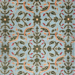 Decorative rug with intricate pattern on a blue background