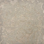 Handknotted rug sample in an organic abstract pattern in soft grey.