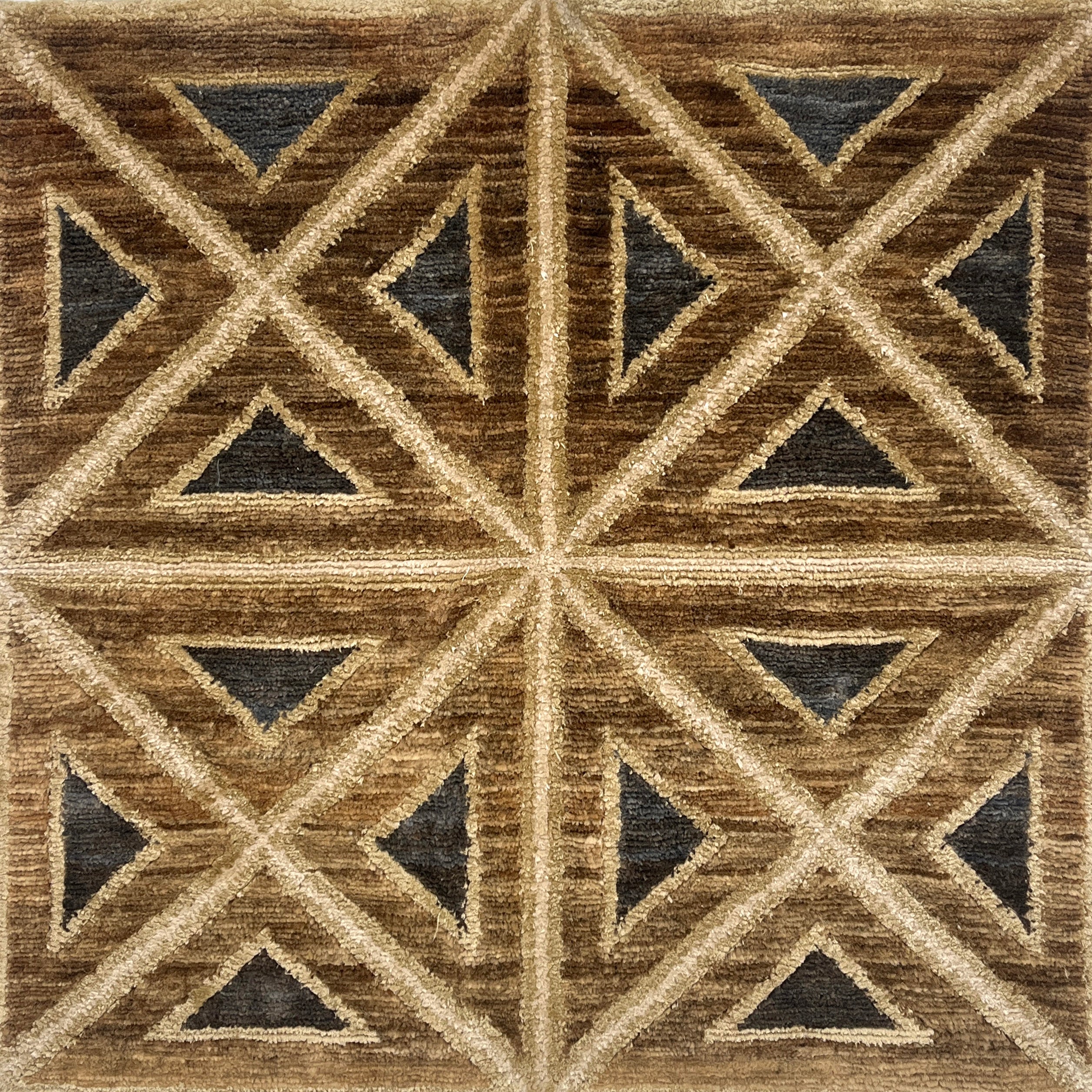 Handknotted rug sample geometric pattern featuring intersecting diagonal lines and triangles in shades of brown, beige, and charcoal gray.