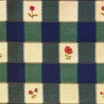 Blue, greena nd cream checkered fabric with floral patterns in alternating squares.