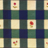 Blue, greena nd cream checkered fabric with floral patterns in alternating squares.