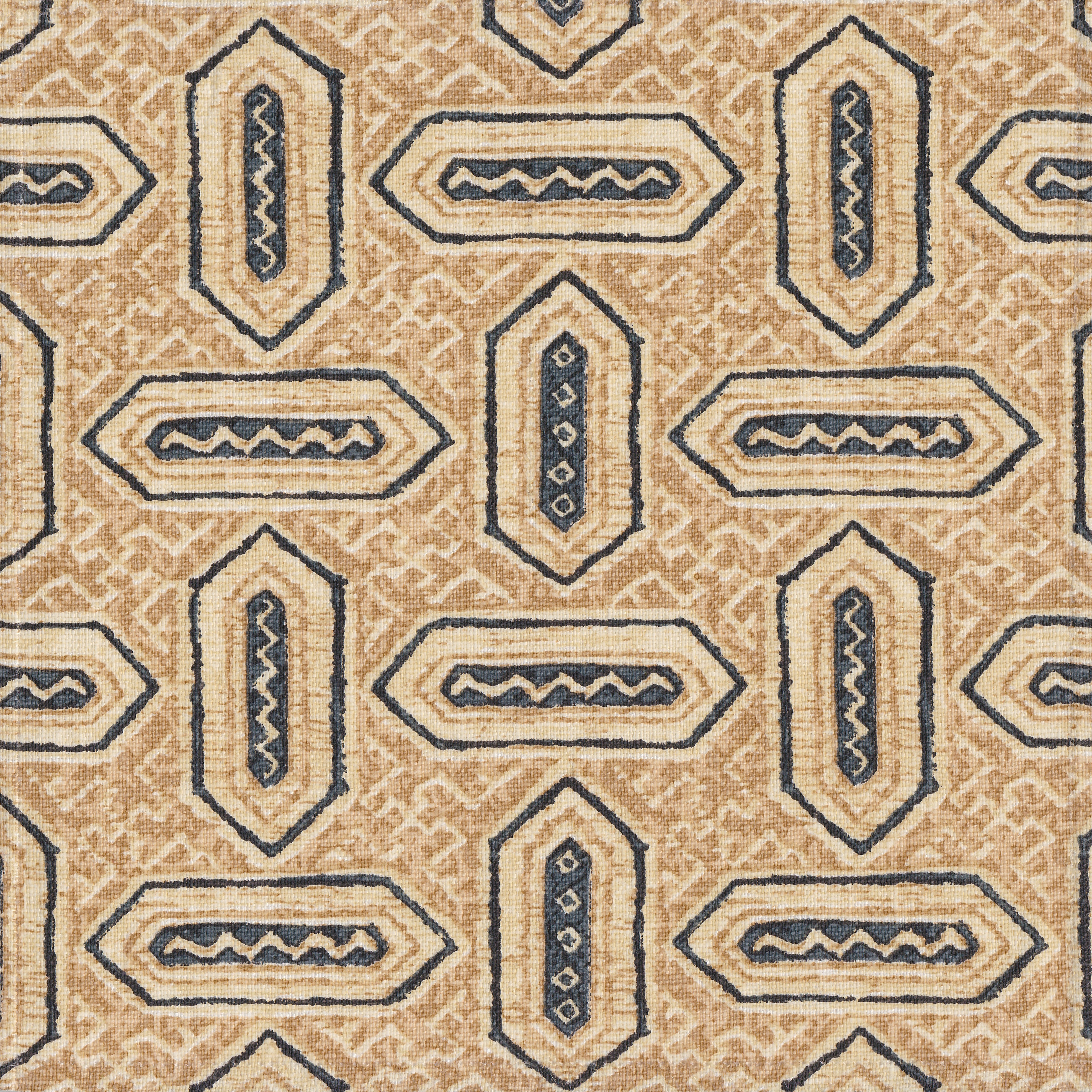 Detail of fabric in a dense geometric print in shades of navy and tan on a cream field.