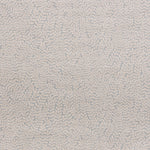 Detail of fabric in a scrolling stem and leaf print in light pink on a gray field.