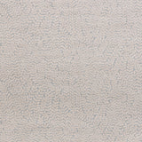Detail of fabric in a scrolling stem and leaf print in light pink on a gray field.