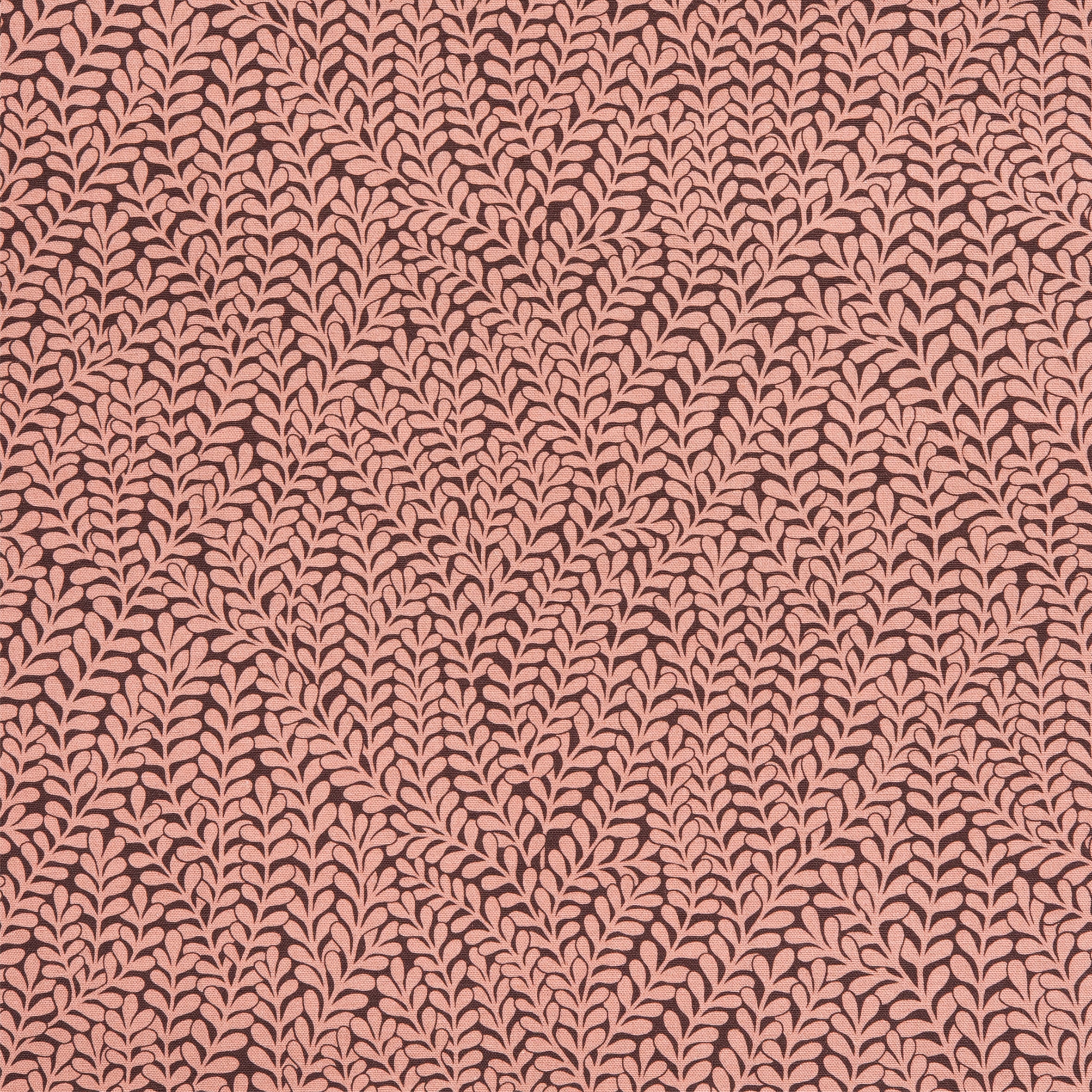 Detail of fabric in a scrolling stem and leaf print in coral on a maroon field.