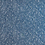 Detail of wallpaper in a scrolling stem and leaf print in navy on a white field.