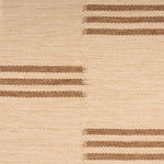 Broadloom flatweave carpet in a broken stripe in brown on a beige field.