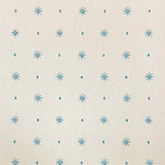 Detail of wallpaper in a bordered teardrop print in blue on a cream field.