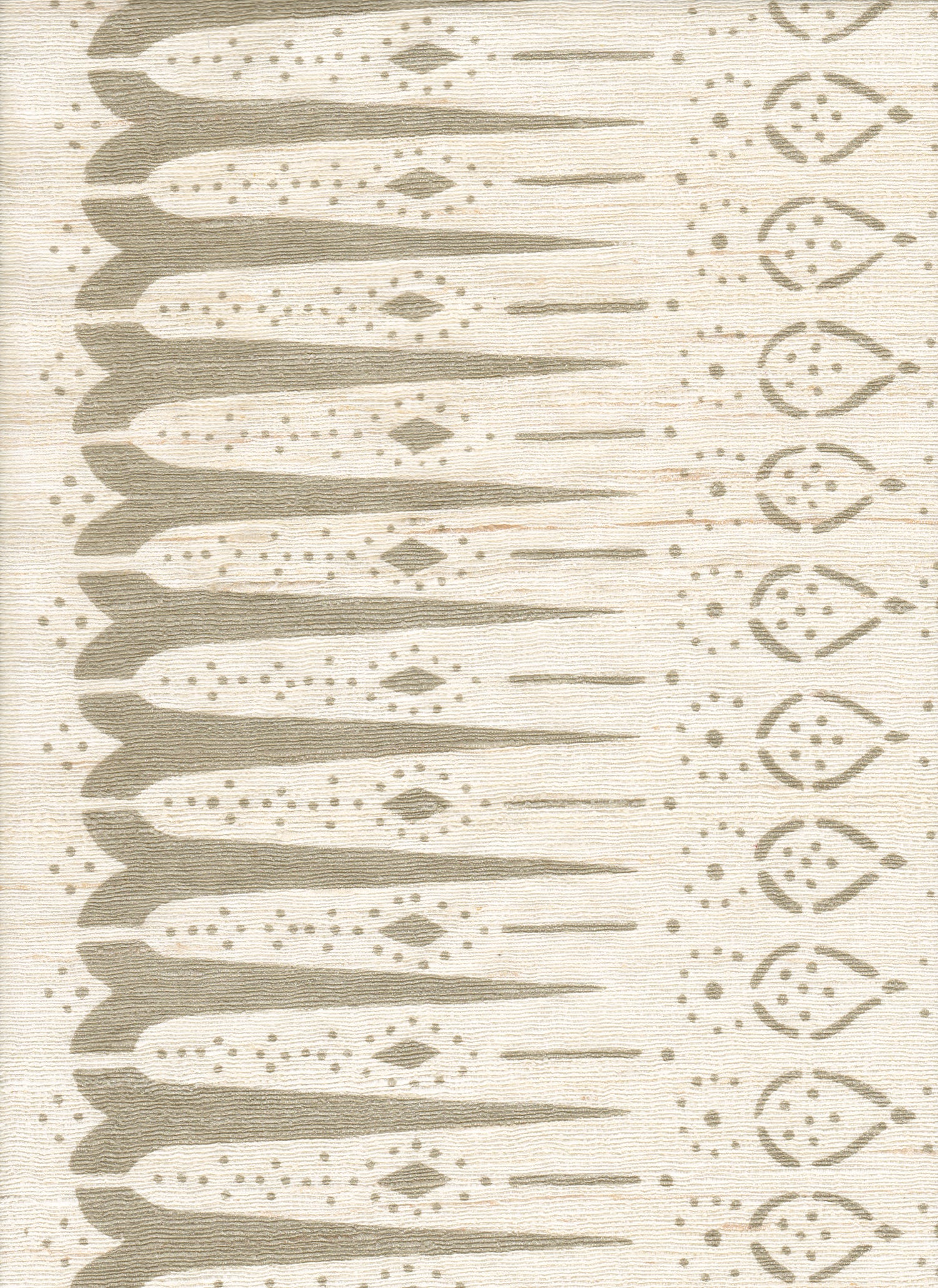 Detail of fabric in a bordered teardrop print in tan on a cream field.