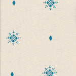 Detail of fabric in a repeating geometric starburst print in turquoise on a cream field.