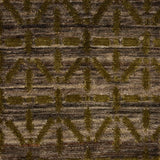 Handknotted rug with olive green linear design on a heather brown field. 