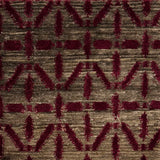 Handknotted rug with magenta linear design on a heather brown field. 