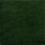 Handknotted rug in wool and merino in solid cut pile in emerald green.