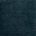Handknotted rug in wool and merino in solid cut pile in dark teal blue.