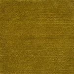 Handknotted rug in wool and merino in solid cut pile in bright mustard yellow.