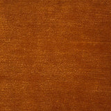 Handknotted rug in wool and merino in solid cut pile in orange.