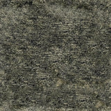 A close-up texture shot of a shaggy silk  high-pile rug in a mottled gray.