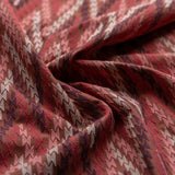 Close-up of patterned fabric with red and beige colors