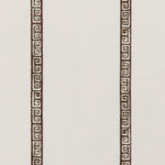 Detail of a linen fabric in a minimal geometric linear pattern in brown on a cream field.