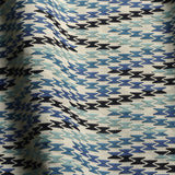 Close-up of fabric with a blue and black geometric pattern