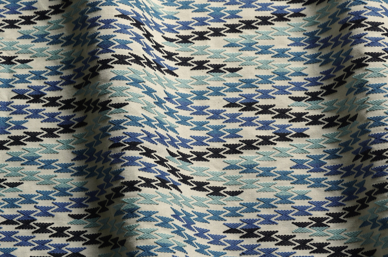 Close-up of fabric with a blue and black geometric pattern