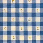 Blue and white checkered fabric with small yellow floral patterns