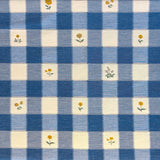 Blue and white checkered fabric with small yellow floral patterns