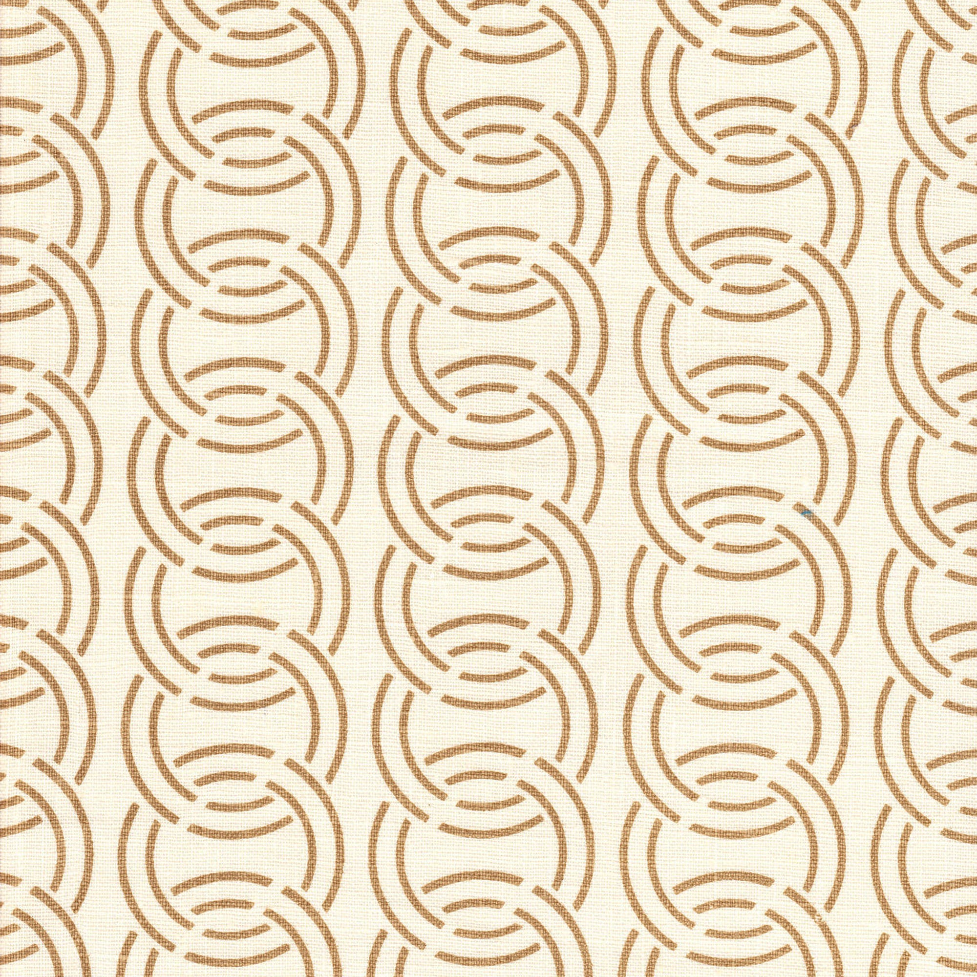 Detail of fabric in an interlocking circular pattern in brown on a cream field.