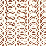 Detail of fabric in an interlocking circular pattern in brown on a cream field.