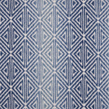 Broadloom carpet with triangle pattern with an ombré background in shades of blue. 