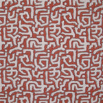 Fabric in an abstract meandering shape print in white and gray on a red field.