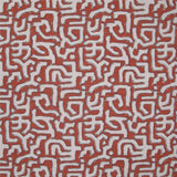 Fabric in an abstract meandering shape print in white and gray on a red field.