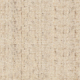 Broadloom carpet in a textural strie in cream accented with brown.