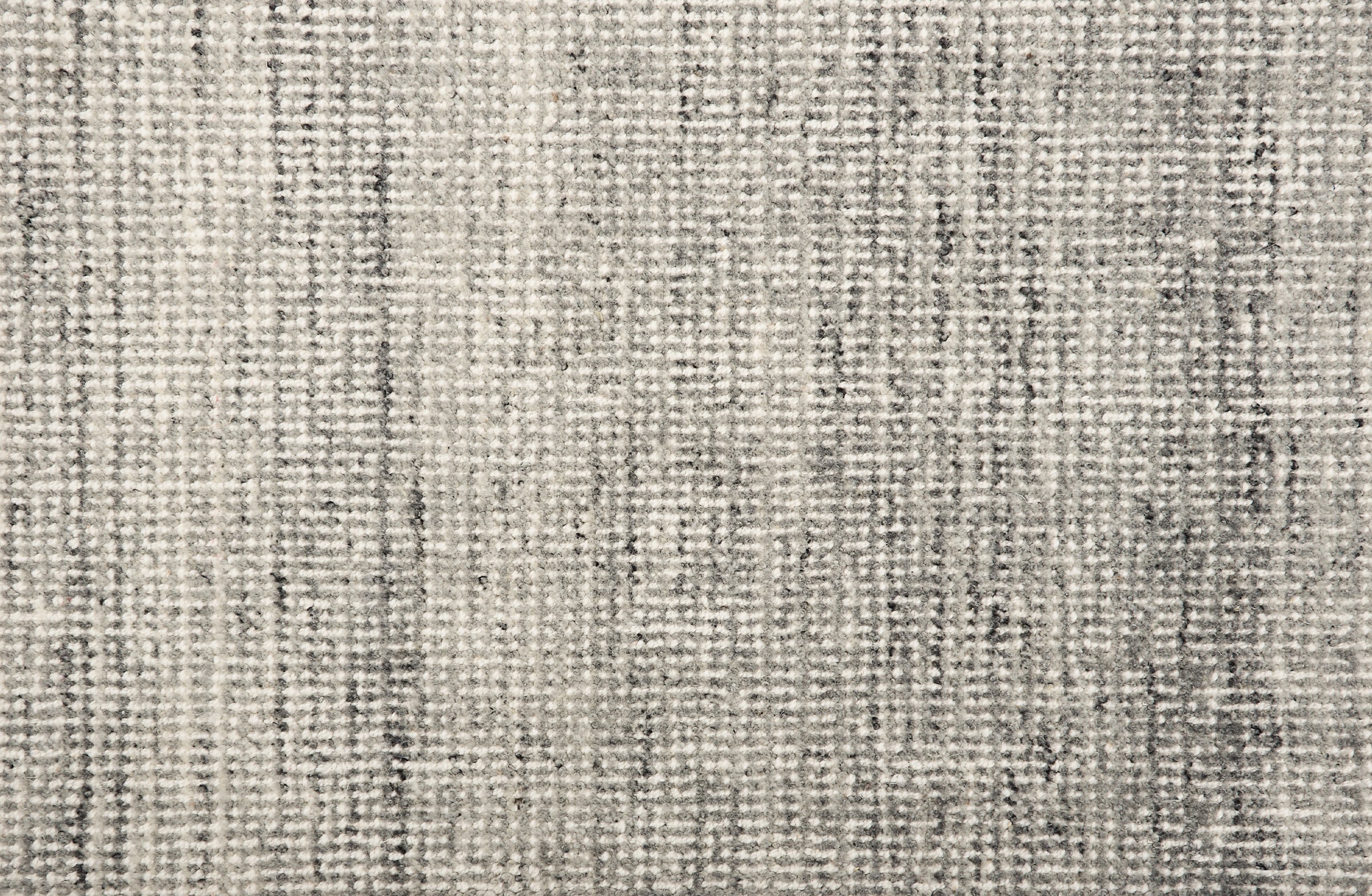 Broadloom carpet in a textural strie in silver with darker grey accents.