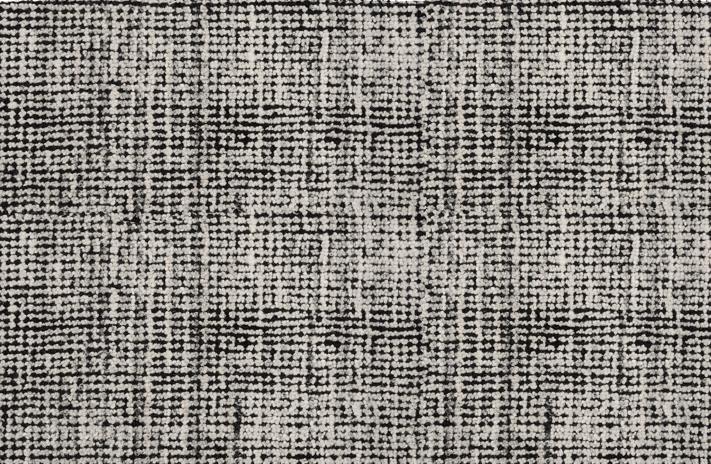 Broadloom carpet in a textural strie in white accented with black