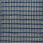 Textured rug with a blue and ivory checker pattern
