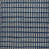 Textured rug with a blue and ivory checker pattern